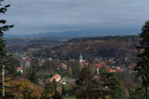 view from the mountain to the cityscape against the background of mountains and blue sky in Polyanica Zdr  j Poland in sunny weather in autumn time