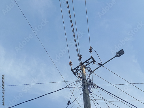 Power lines on blue sky background