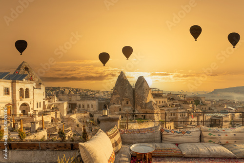 Terrace roof top morning sunrise and balloons fly at Cappadocia, Turkey. photo