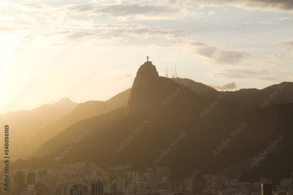 Sunset with Christ the Redeemer in Rio de Janeiro and its mountains Sunset with Christ the Redeemer in Rio de Janeiro and its mountains