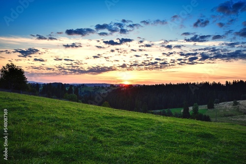Beautiful morning summer landscape. Sunrise in Gilczarow Gorny village in Poland.