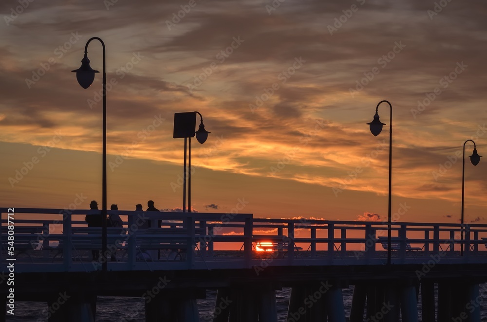 Beautiful morning seaside landscape. Popular pier in Gdynia, Poland at sunrise.