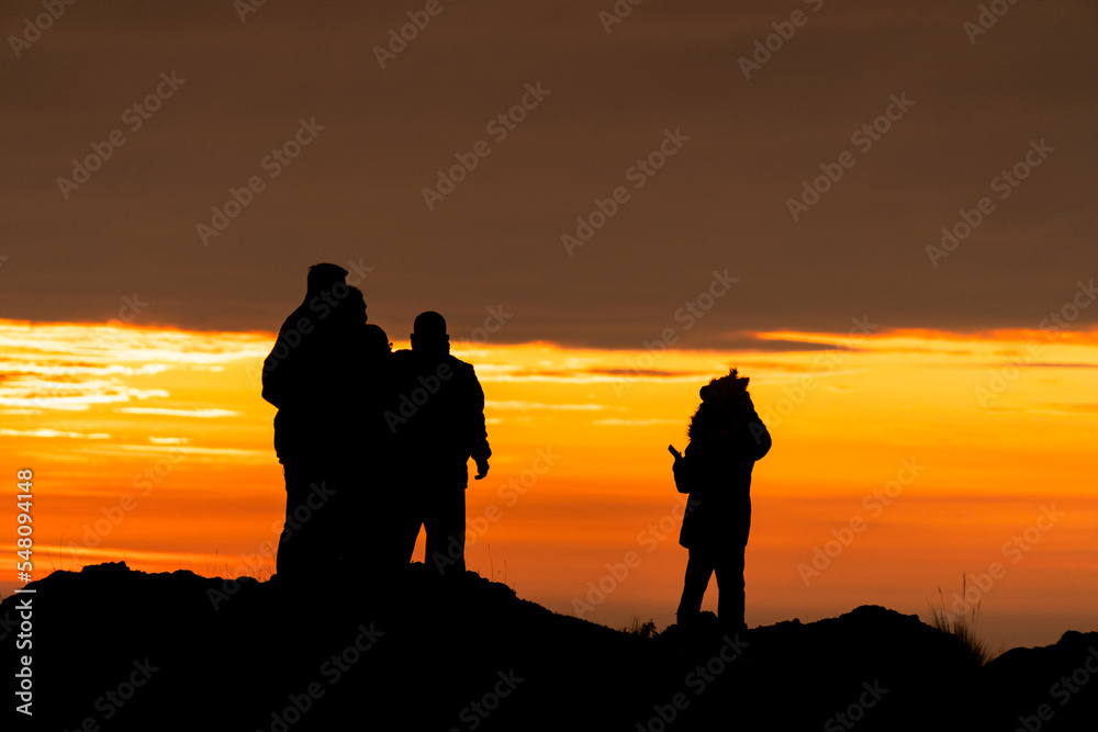 Group of people in a sunset, sunset silhouette