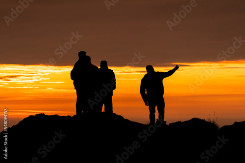 Group of people in a sunset, sunset silhouette