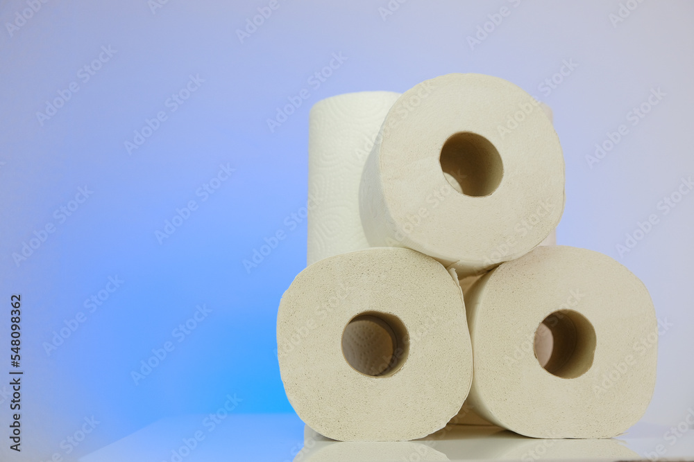 Toilet paper on a blue background.Purchase and shortage of toilet paper.Cleanliness and health. crisis of the paper industry in Europe. Toilet paper on a blue background.Purchase and shortage of toilet paper.Cleanliness and health. crisis of the paper industry in Europe.