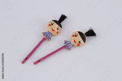 Kid's safety chopsticks with female Asian head at the top