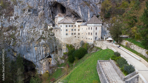 Predjama castle is a unique cave what built in a cave entrance. Renessiance style fortress from 12th century in Slovenia Julian apls Mountains. One of the biggest cave castles of the world photo