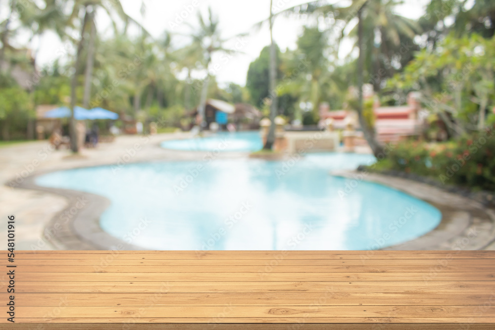 Boards wood with unfocused background luxury swimming pool