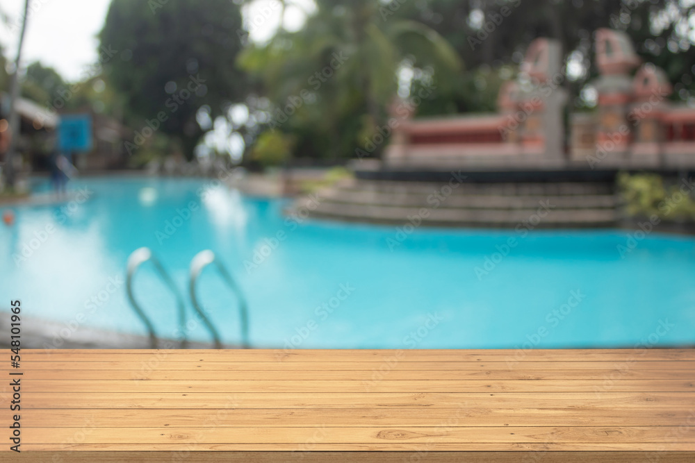 Fototapeta premium Boards wood with unfocused background luxury swimming pool