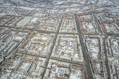 City panorama from the height of the drone flight. Residential area of brick houses in the winter. Aerial view. Nizhny Tagil, Russia