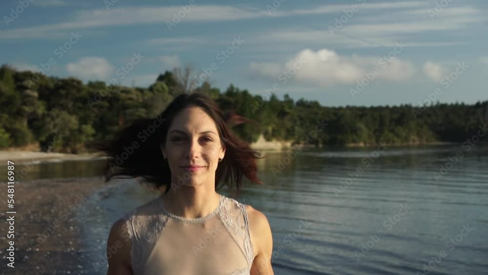 Woman running on morning beach, front face close up gimbal view, slow motion Woman running on morning beach, front face close up gimbal view, slow motion