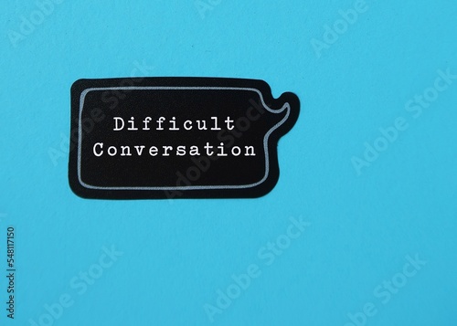 Speech sticker on blue copy space background with text DIFFICULT CONVERSATION concept of request to have serious talk in sensible subjects at work or relationship, discuss personal issues conflict