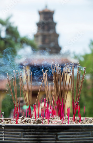 Incense sticks in a buddhist temple photo