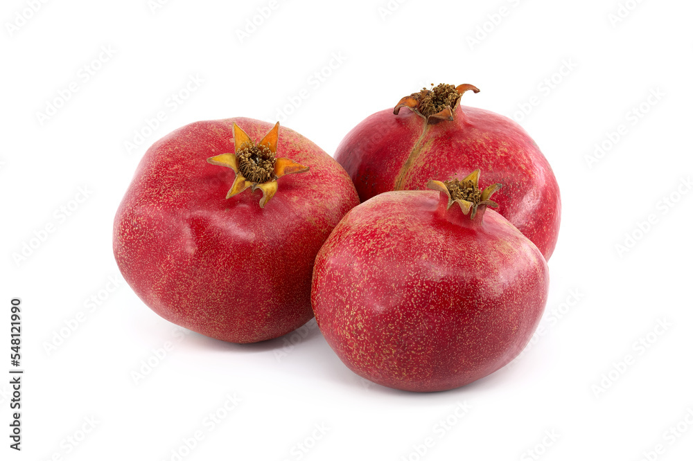 Three whole pomegranate fruits isolated on white Three whole pomegranate fruits isolated on white
