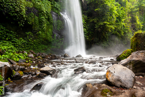 Lombok  Tiu Kelep waterfall in Senaru  Lombok  Indonesia. Tourists from overseas were enjoying the waterfall.
