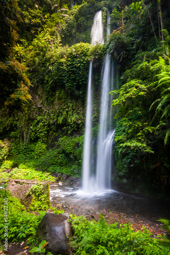 Lombok, Tiu Kelep waterfall in Senaru, Lombok, Indonesia. Tourists from overseas were enjoying the waterfall.