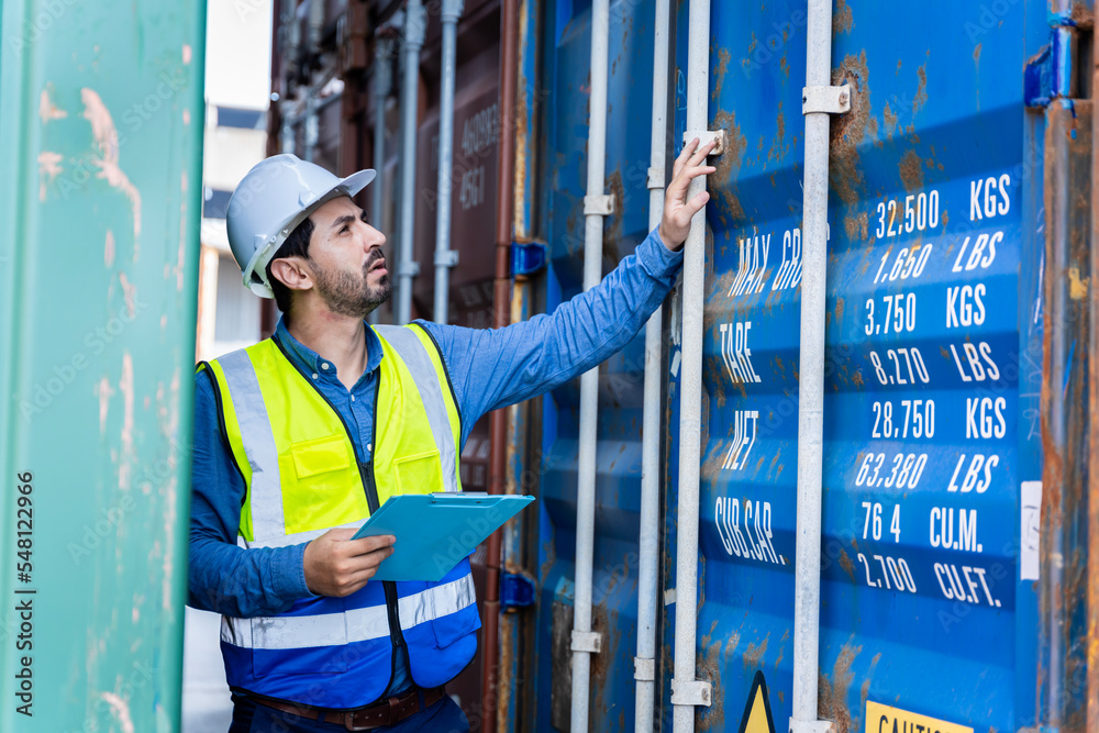male engineers in a container shipping company Consulting to check the order for the container that is responsible	
