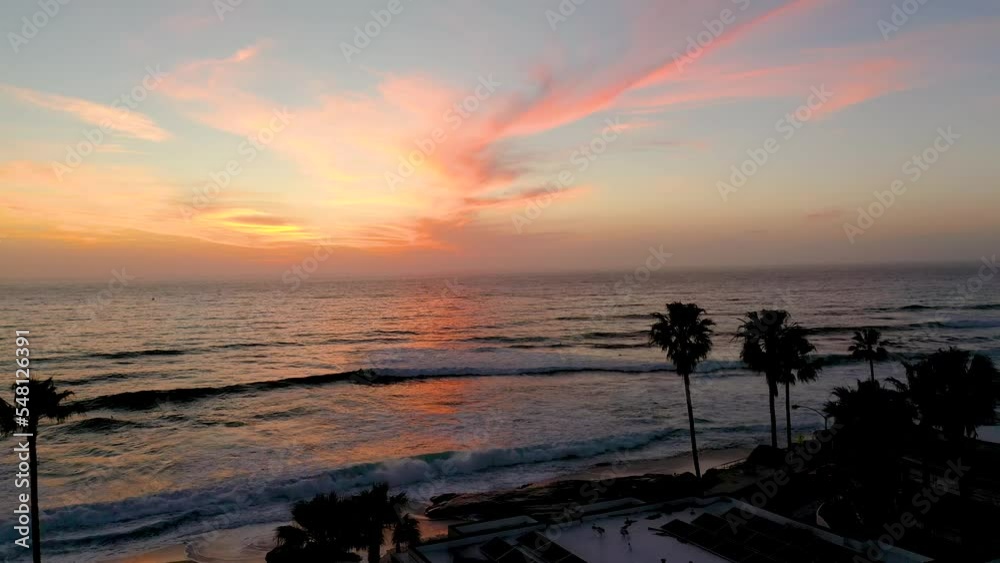 Sunset and palm trees aerial shot of California beach during golden hour Sunset and palm trees aerial shot of California beach during golden hour