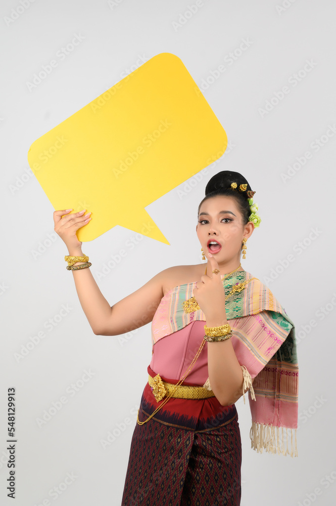 Young beautiful woman in Thai lanna costume with blank speech bubble sign Young beautiful woman in Thai lanna costume with blank speech bubble sign