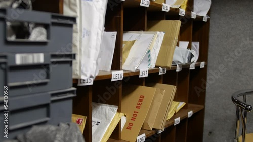 A post office mail room and sorting office with letters and shelving photo