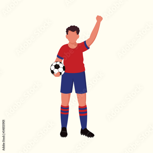 Faceless Soccer Player Holding Ball In Standing Pose Against Cosmic Latte Background.