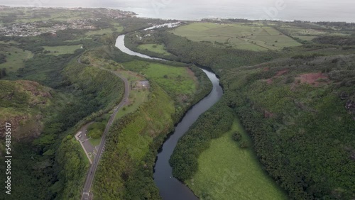 Wallpaper Mural Dramatic aerial footage of famous Wailua River with Pacific ocean coastline and a driveway Jungle landscape  Kauai Hawaii with waterfalls and scenic natural wonders. sunset, Kauai island, Hawaii, USA Torontodigital.ca
