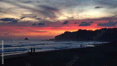 Sunset at the beach in Zipolite, Mexico photo