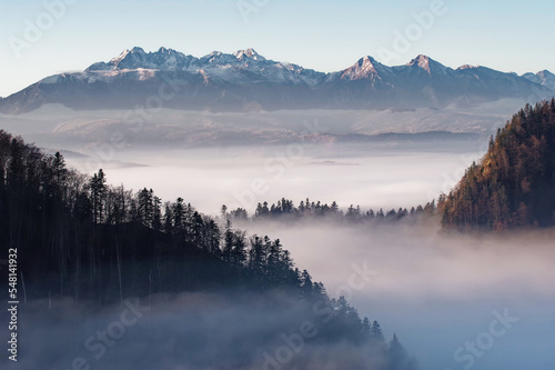 View of the Tatra Mountains from the Pieniny Mountains, autumn and winter landscape.