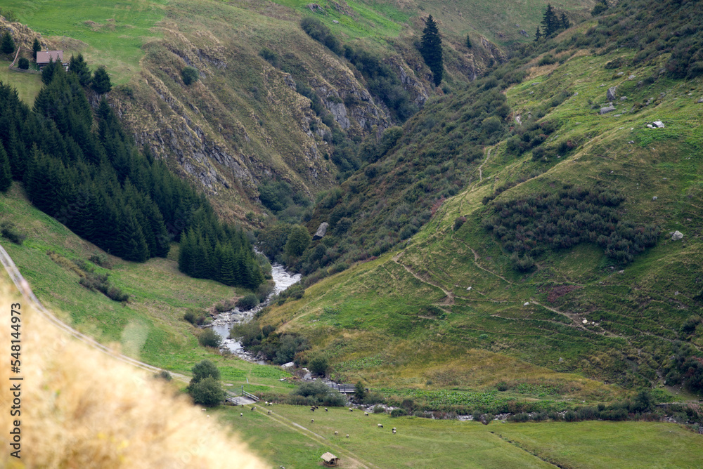 Aerial view over scenic landscape with anterior Rhine River at Swiss mountain pass Oberalppass on a blue cloudy late summer morning. Photo taken September 5th, 2022, Oberalp Pass, Switzerland.
