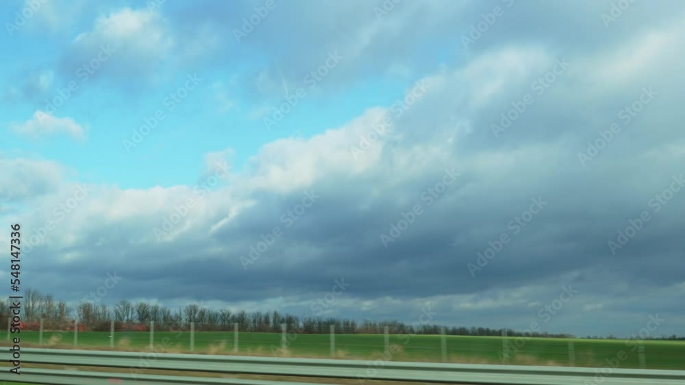 shooting the road during the day from the car window. a trip by car. shooting the road during the day from the car window. a trip by car.