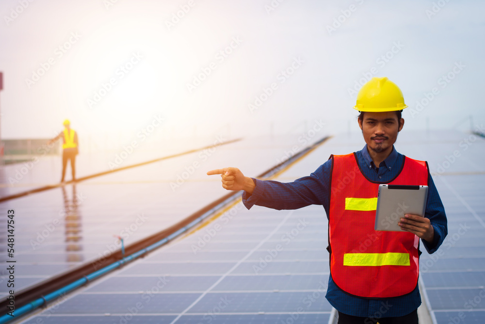 Photovoltaic Technology, Service Engineer Checking Solar Rooftop Installation of Factory Morning Silhouette Technician Checking and Repairing Solar Rooftop of Factory. Photovoltaic Technology, Service Engineer Checking Solar Rooftop Installation of Factory Morning Silhouette Technician Checking and Repairing Solar Rooftop of Factory.