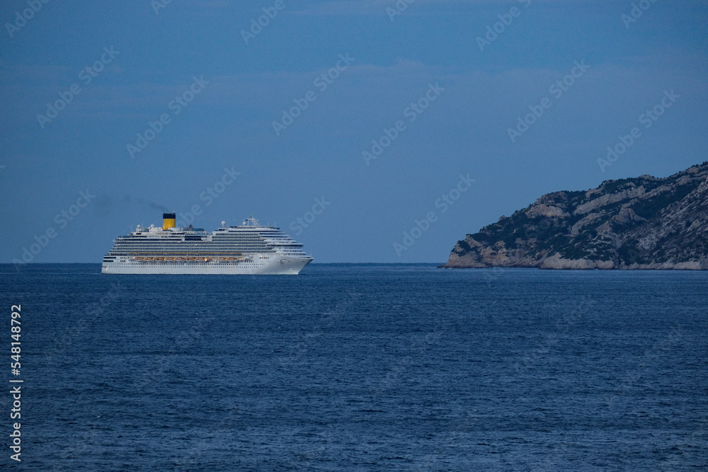 Costa cruiseship or cruise ship liner Diadema arrival into Marseille Provence port during sunrise twilight blue hour Mediterranean cruise dream vacation	