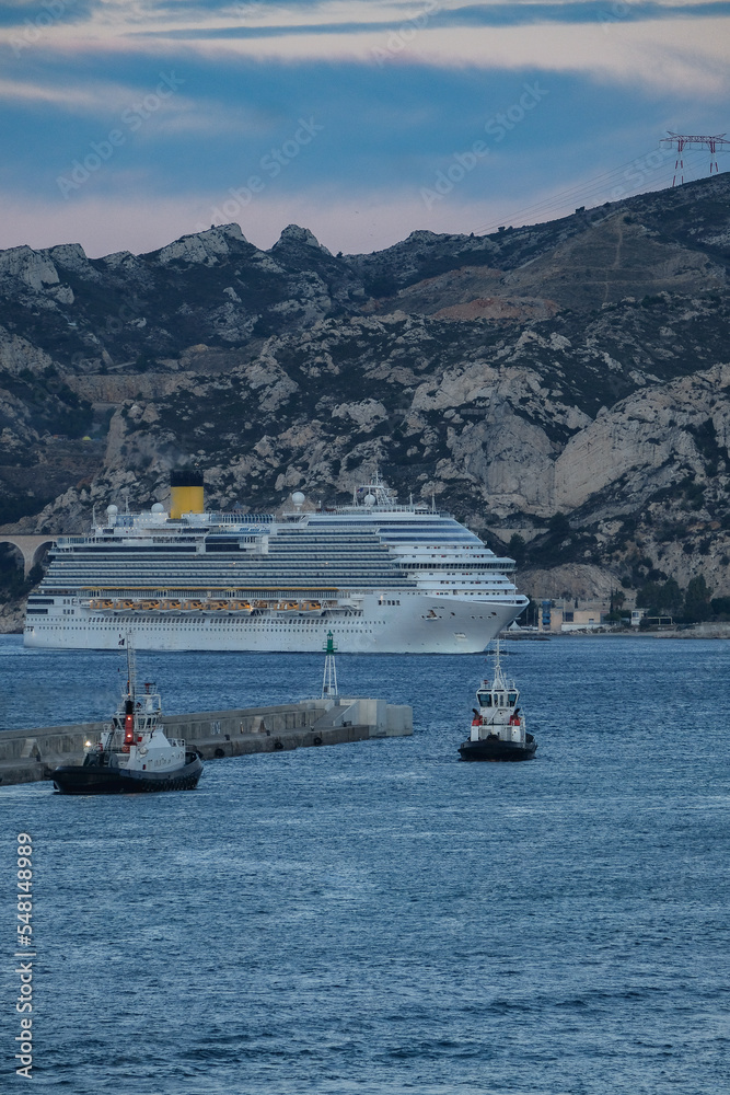 Costa cruiseship or cruise ship liner Diadema arrival into Marseille Provence port during sunrise twilight blue hour Mediterranean cruise dream vacation Costa cruiseship or cruise ship liner Diadema arrival into Marseille Provence port during sunrise twilight blue hour Mediterranean cruise dream vacation