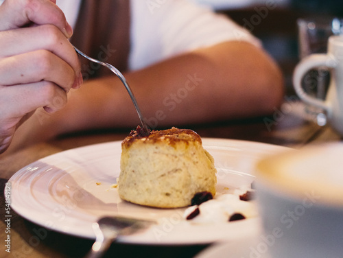 eating a scone in a cafe - close-up food and beverage 