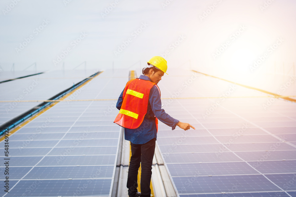 Photovoltaic Technology, Service Engineer Checking Solar Rooftop Installation of Factory Morning Silhouette Technician Checking and Repairing Solar Rooftop of Factory. Photovoltaic Technology, Service Engineer Checking Solar Rooftop Installation of Factory Morning Silhouette Technician Checking and Repairing Solar Rooftop of Factory.