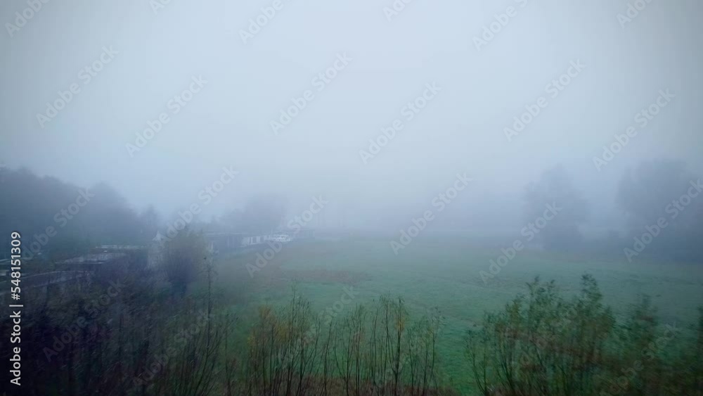 An aerial shot of a pasture field covered in fog in 4K concept for creepy foggy field An aerial shot of a pasture field covered in fog in 4K concept for creepy foggy field