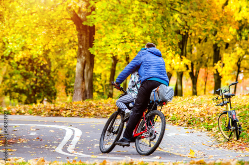 Cyclist ride on the bike path in the city Park
