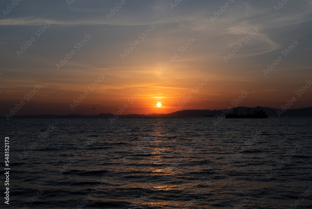 Beautiful orange sunset over the sea with soft selective focus. Beauty of nature concept