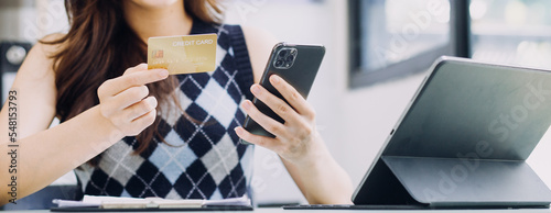 Fotografie Businessman hand using laptop compter with holding cradit card payments online shopping or business