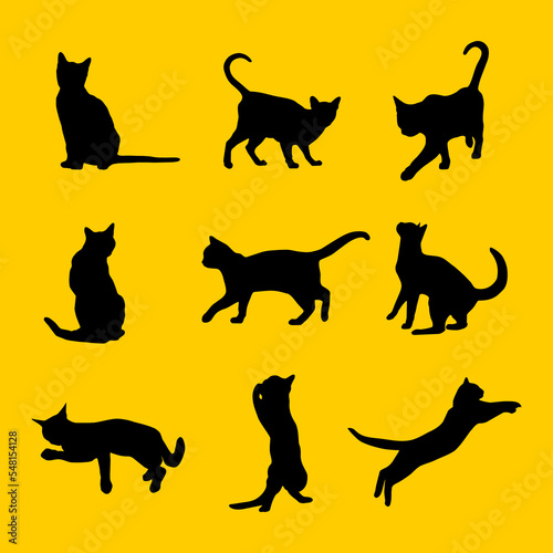 Fototapeta Naklejka Na Ścianę i Meble -  Set vector silhouette of the cat different poses black color isolated on yellow background