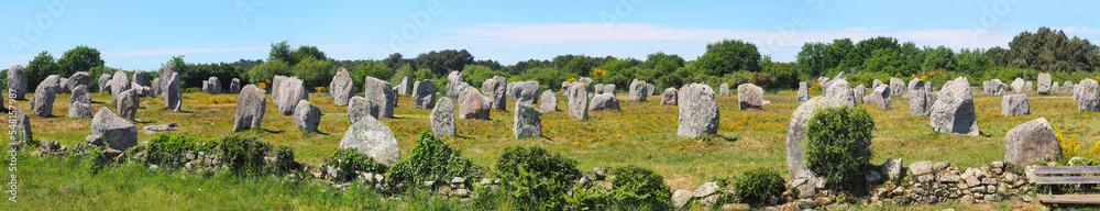 Panoramic view of the alignments of menhirs of Carnac, a famous Neolithic UNESCO World Heritage site located in Brittany in western France Panoramic view of the alignments of menhirs of Carnac, a famous Neolithic UNESCO World Heritage site located in Brittany in western France