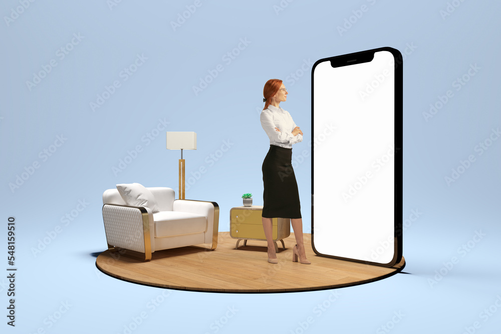 Young girl standing in front of huge 3d model of cellphone with blank white screen and thinking isolated on blue background. Online working, payment, new app - obrazy, fototapety, plakaty 