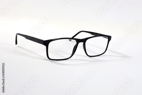 modern elegant glasses in a dark frame on a white background