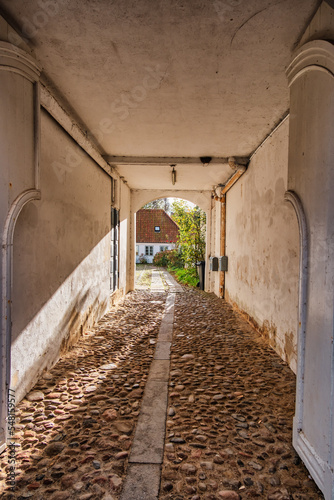 Fototapeta Naklejka Na Ścianę i Meble -  Small pathway in medieval city of Ribe, Denmark