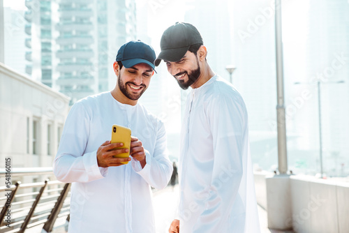 Bild auf Leinwand Two young men going out in Dubai
