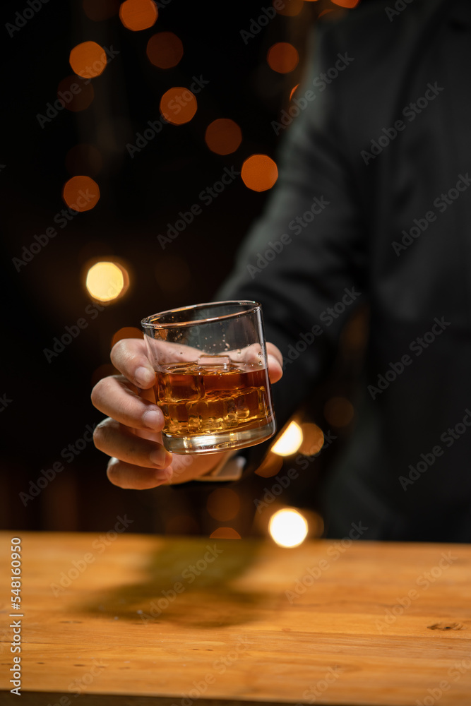 Barman pouring whiskey whiskey glass beautiful night