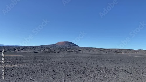 Scenic landscape of Volcan Carachi Pampa under the blue sky photo