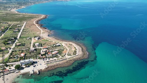 Aerial view of the coast at Custonaci. Beautiful view of the turquoise Mediterranean sea. Sunny day. Sicily. Italy photo