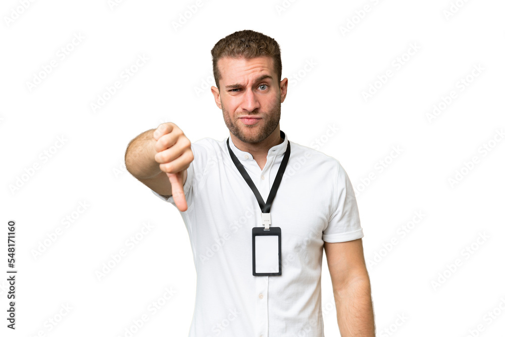 Young caucasian man with ID card isolated on green chroma background showing thumb down with negative expression Young caucasian man with ID card isolated on green chroma background showing thumb down with negative expression