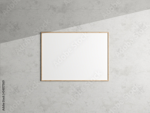 Minimal poster picture frame mockup hanging on the white wall. Blank frame mockup. Clean, modern, minimal frame. 3d rendering.
